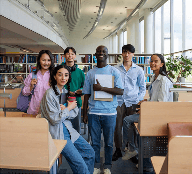 Students in a library collaborating